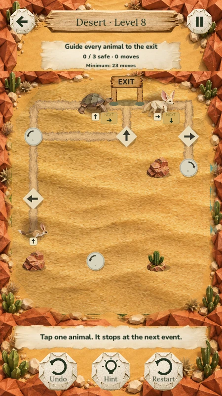 Desert puzzle with paper animals, rocks, a cactus and direction signs leading to the top exit